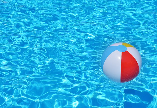 Colorful-inflatable-ball-floating-in-swimming-pool-